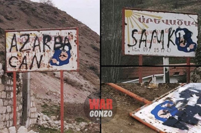 4 soldats Azéris inscrivent des tags anti-Arméniens sur des panneaux de signalisation sur une route de l’Artsakh menant à Stepanakert près de Chouchi